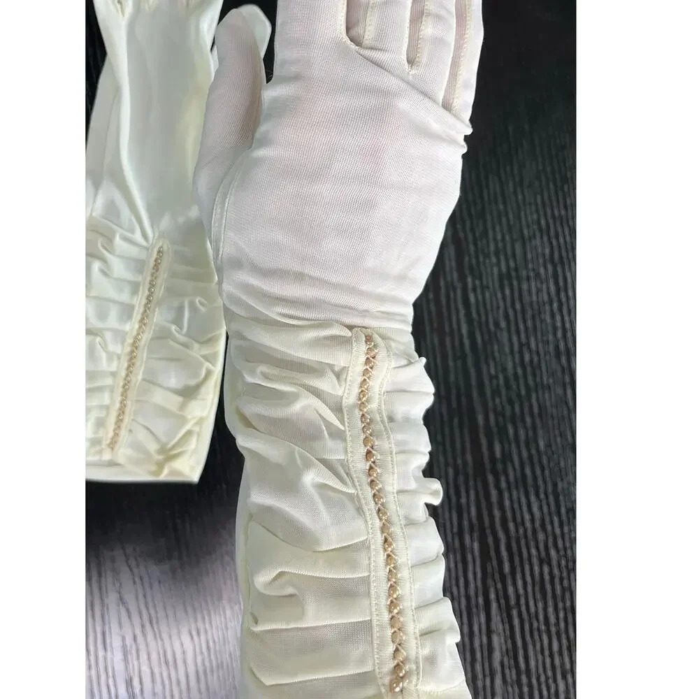 Vintage 60's era elegant long dress gloves tagged with faux pearl accents